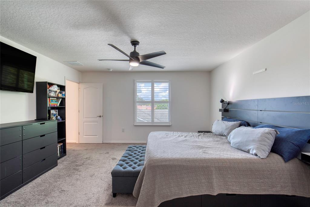 276 Farmbrook Road Port Orange, FL 32127 - Photo 41 of 62 a bedroom with a bed and a flat screen tv