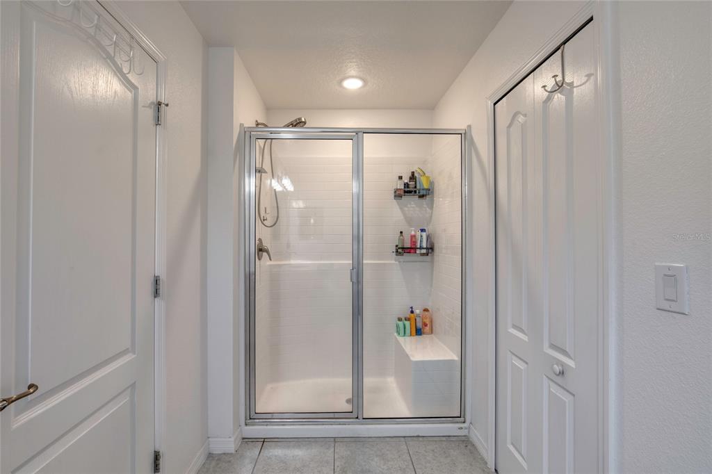 276 Farmbrook Road Port Orange, FL 32127 - Photo 43 of 62 a bathroom with a shower and a sink