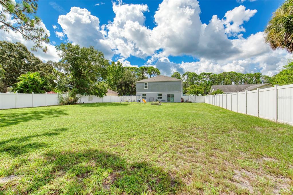 276 Farmbrook Road Port Orange, FL 32127 - Photo 47 of 62 a view of a house with a yard
