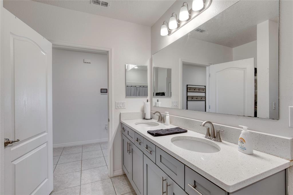276 Farmbrook Road Port Orange, FL 32127 - Photo 10 of 62 a bathroom with a sink and a mirror