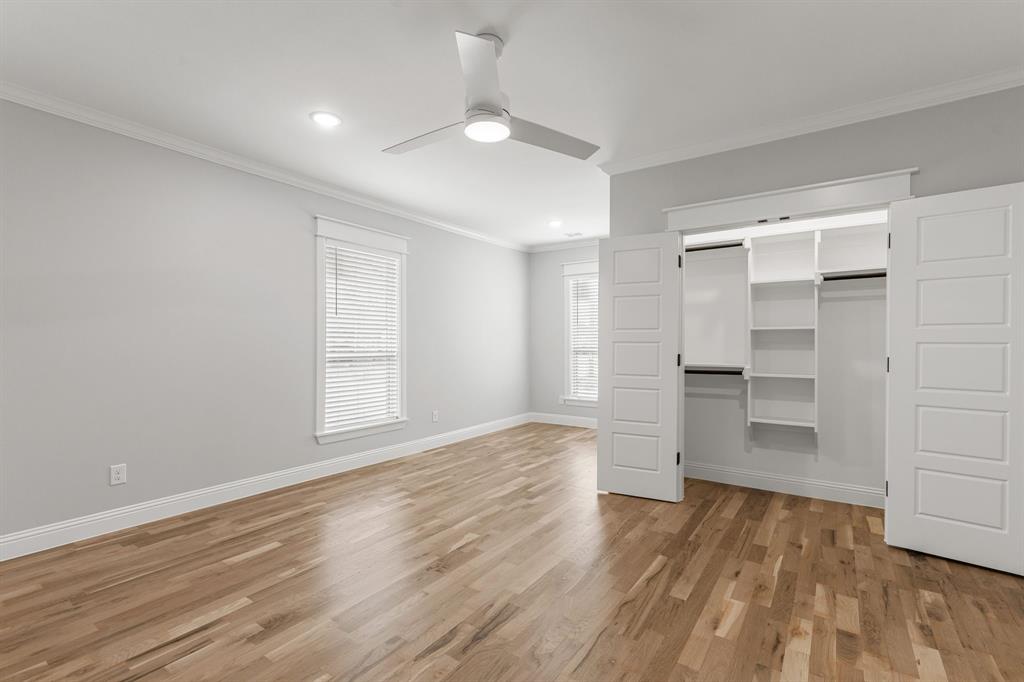1616 Monroe Street Wichita Falls, TX 76309 - Photo 12 of 21 a view of empty room with wooden floor and kitchen