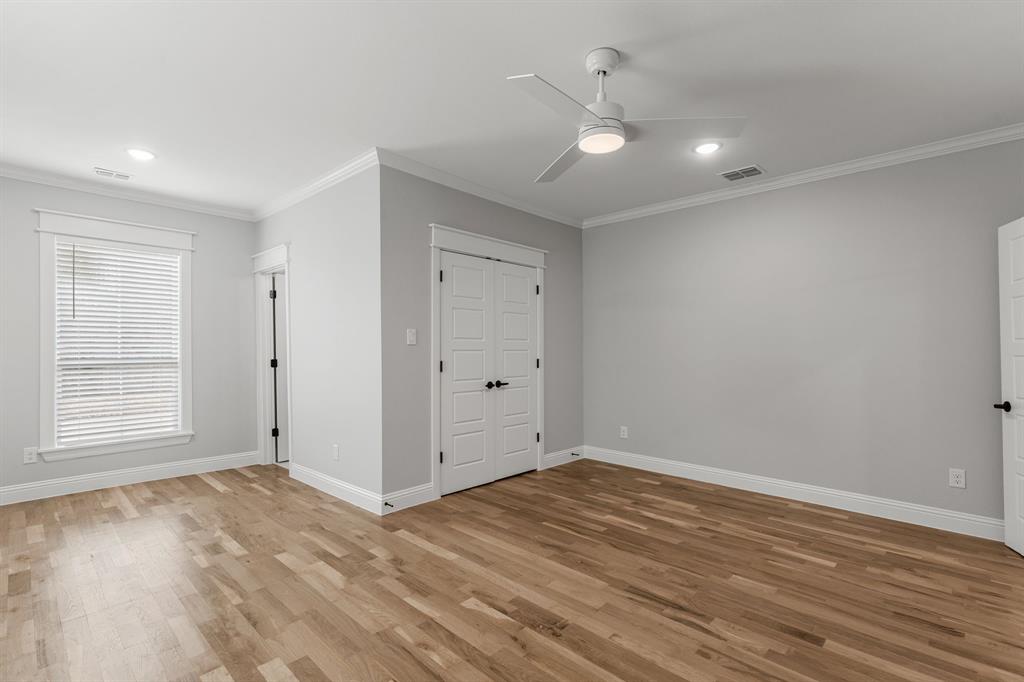 1616 Monroe Street Wichita Falls, TX 76309 - Photo 13 of 21 wooden floor in an empty room with a window