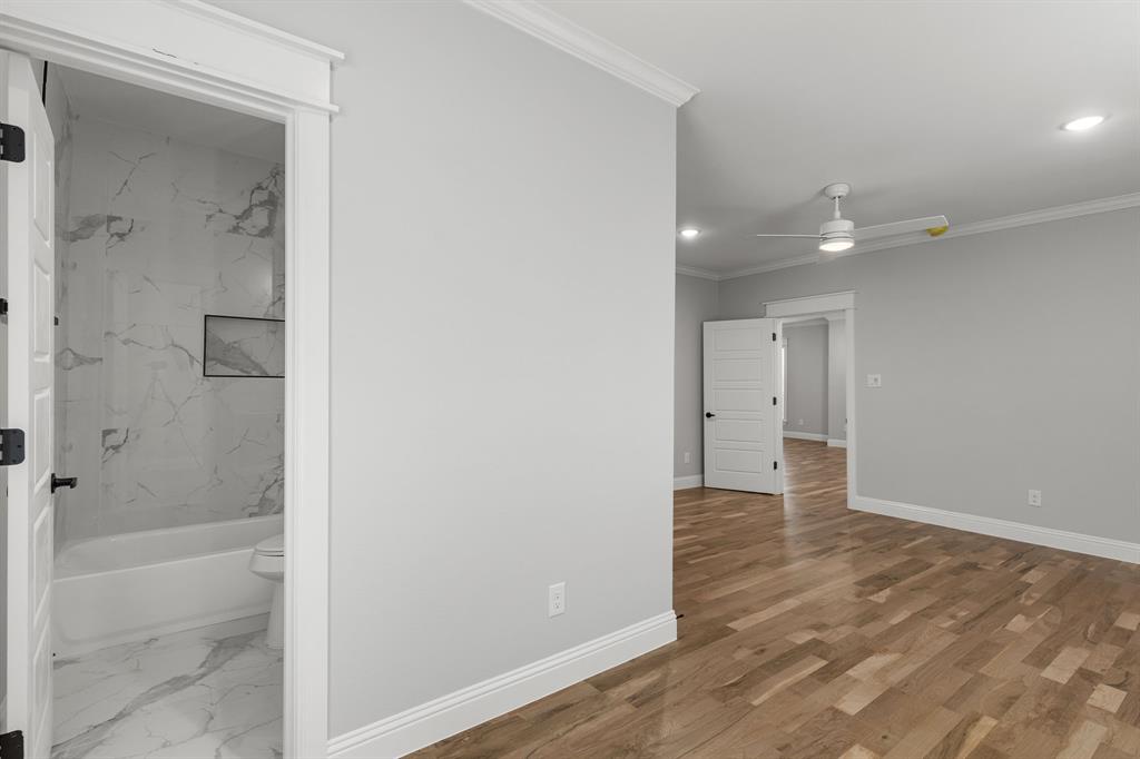 1616 Monroe Street Wichita Falls, TX 76309 - Photo 14 of 21 a bathroom with a shower and a glass door