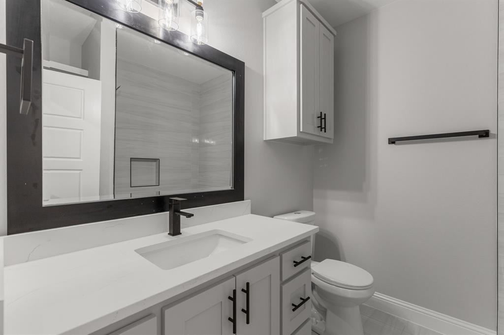 1616 Monroe Street Wichita Falls, TX 76309 - Photo 17 of 21 a bathroom with a sink and a toilet