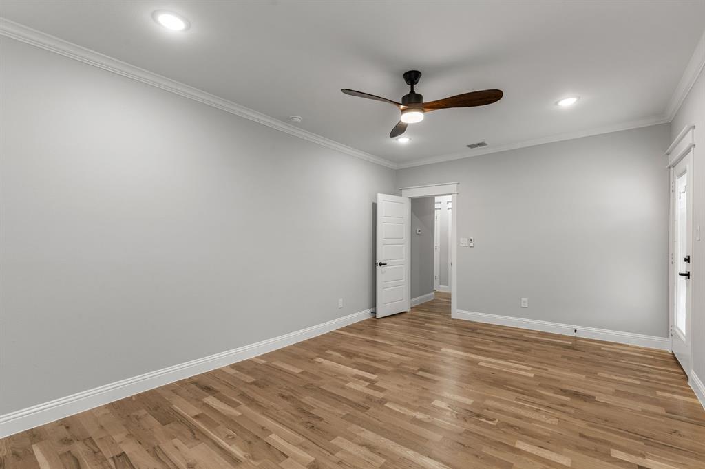 1616 Monroe Street Wichita Falls, TX 76309 - Photo 6 of 21 an empty room with wooden floor and ceiling fan