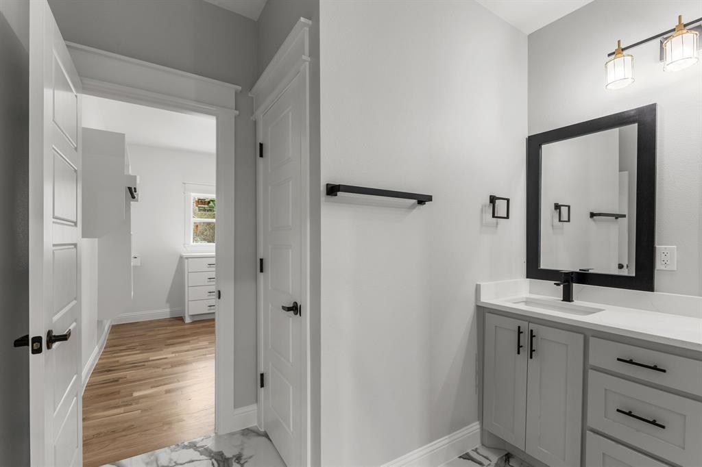 1616 Monroe Street Wichita Falls, TX 76309 - Photo 7 of 21 a bathroom with a sink and a mirror