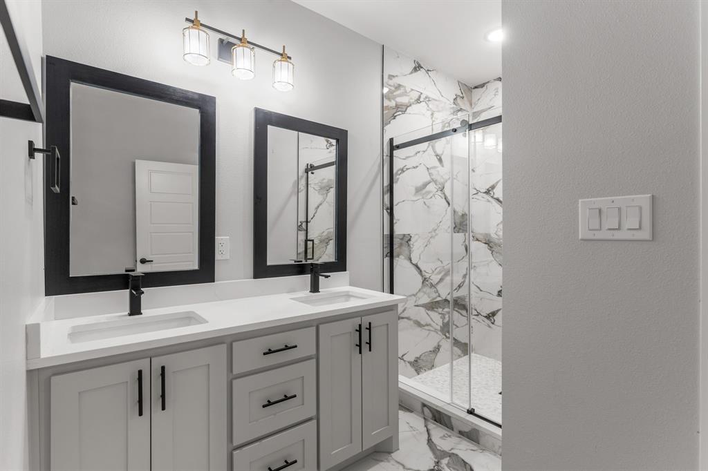 1616 Monroe Street Wichita Falls, TX 76309 - Photo 8 of 21 a bathroom with a sink vanity granite and a mirror