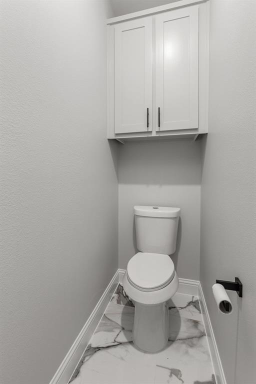 1616 Monroe Street Wichita Falls, TX 76309 - Photo 10 of 21 a bathroom with a toilet