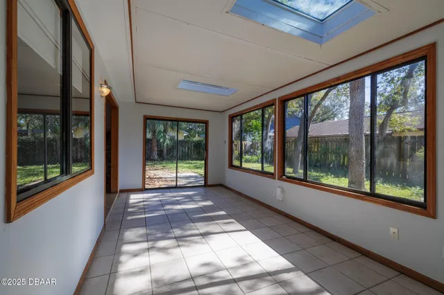 a view of a room with a large window