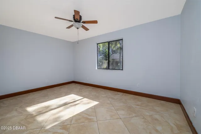 a view of an empty room and a window