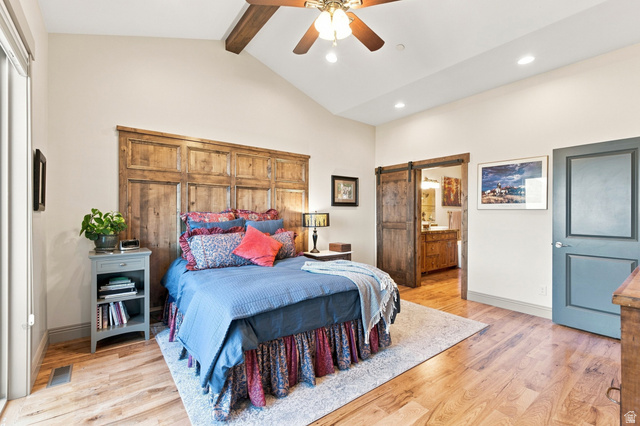 5207 North Oldgate Road Heber City, UT 84032 - Photo 18 of 58 Vaulted ceiling with wood-finish beam and ceiling fan, wood-finish flooring, and a large wood headboard