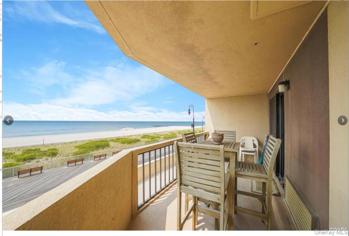 360 Shore Road, Unit 3D Long Beach, NY 11561 - Photo 3 of 8 a view of a balcony with chairs