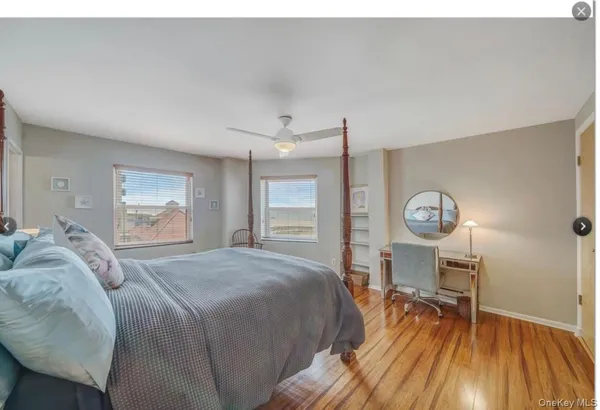 a bedroom with a bed and a table in it