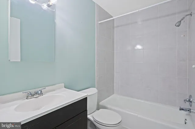 a bathroom with a sink toilet and bathtub