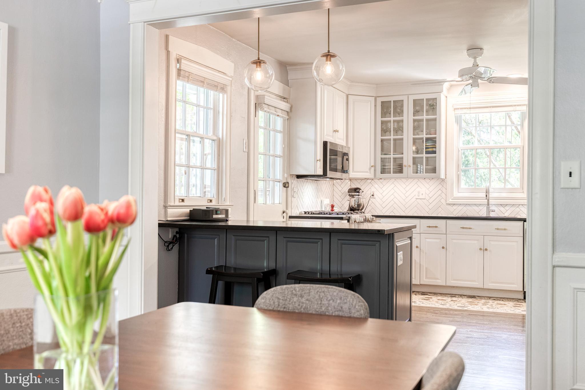 225 Tunbridge Road Baltimore, MD 21212 - Photo 28 of 65 a kitchen with granite countertop a sink cabinets and window