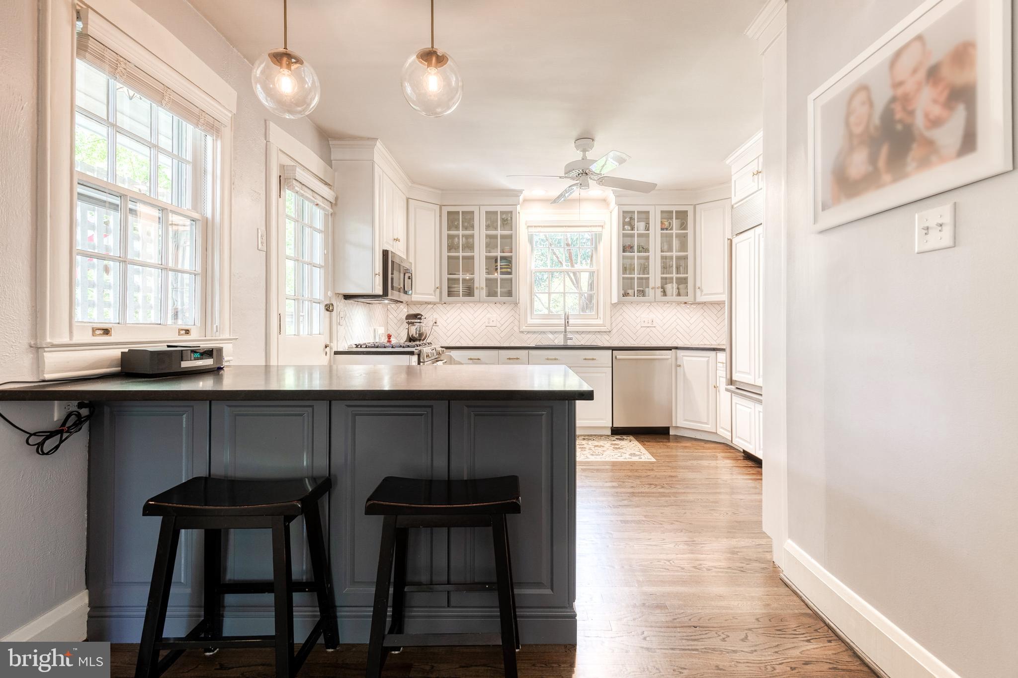 225 Tunbridge Road Baltimore, MD 21212 - Photo 29 of 65 a kitchen with a sink cabinets and window