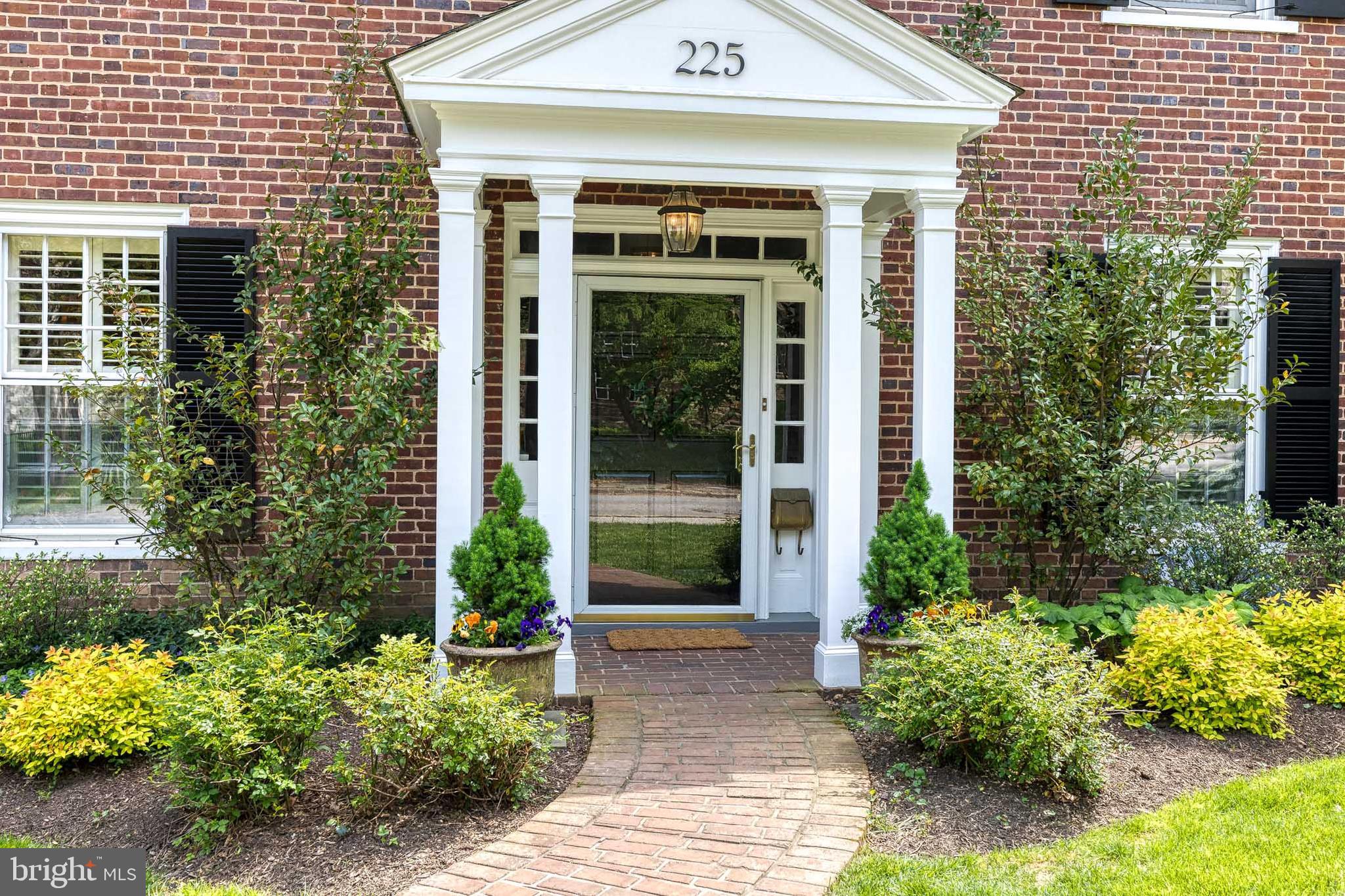 225 Tunbridge Road Baltimore, MD 21212 - Photo 3 of 65 a view of a house with potted plants and a flower garden