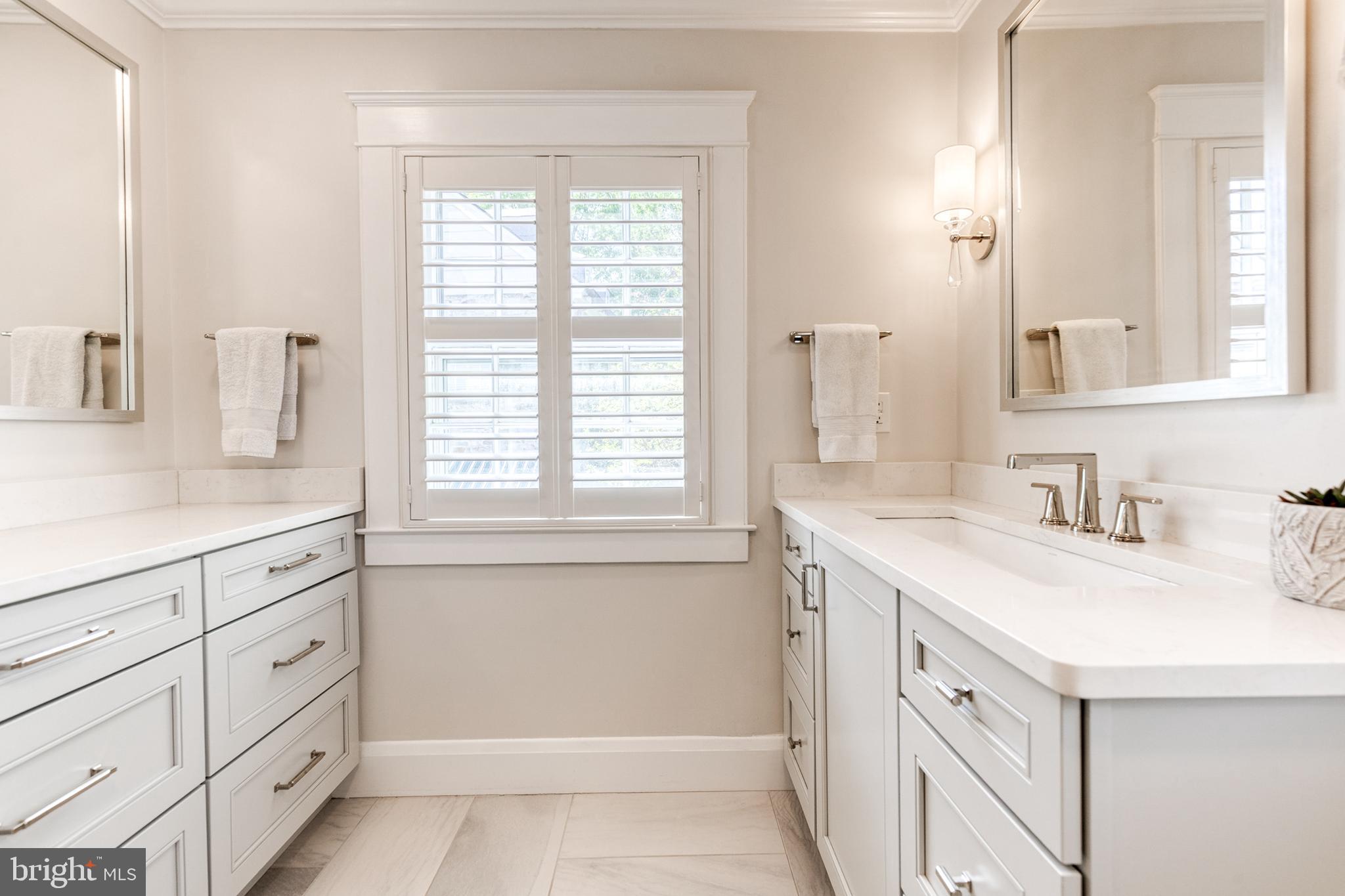 225 Tunbridge Road Baltimore, MD 21212 - Photo 39 of 65 a bathroom with a sink vanity granite tub and a mirror
