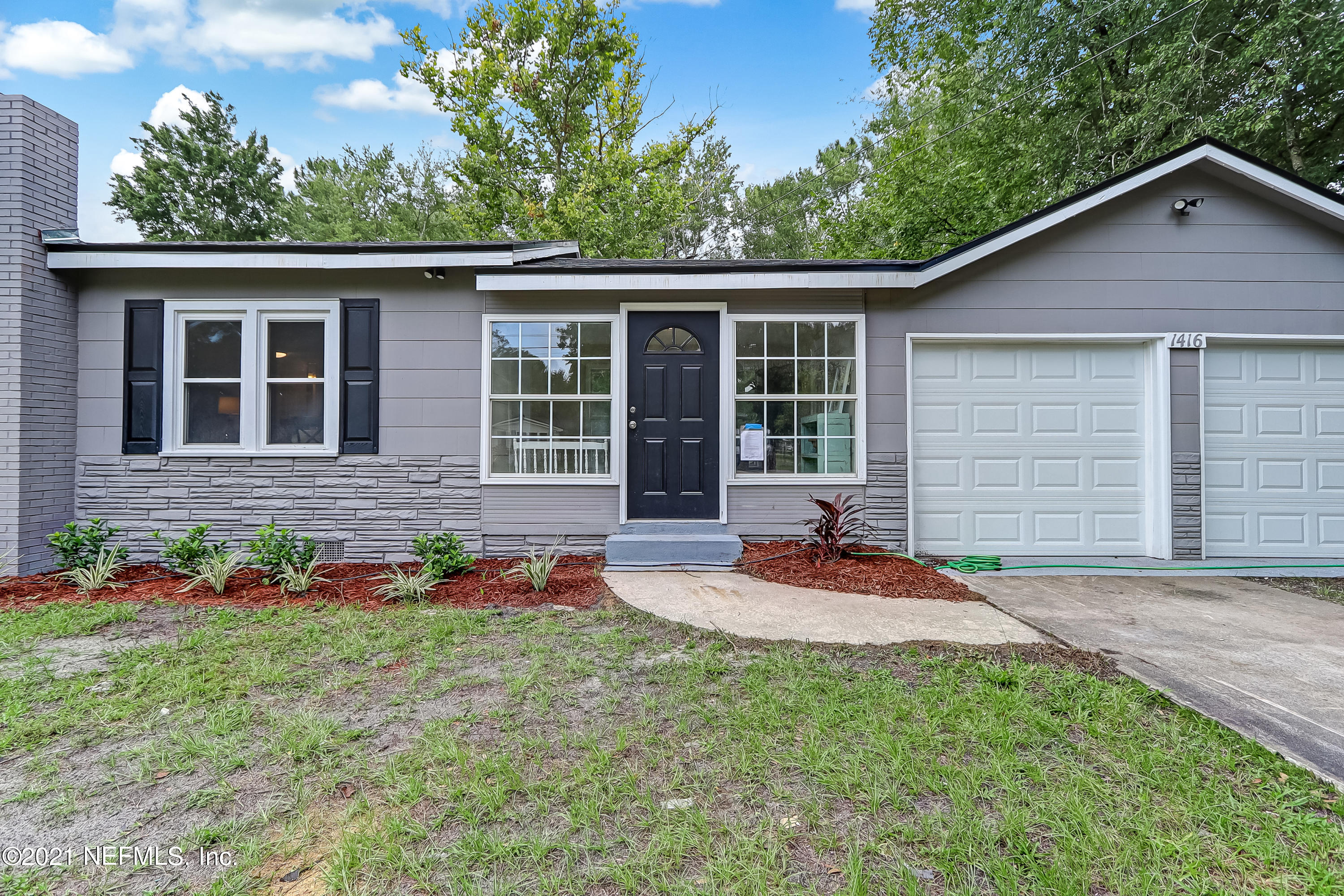 a front view of house with yard