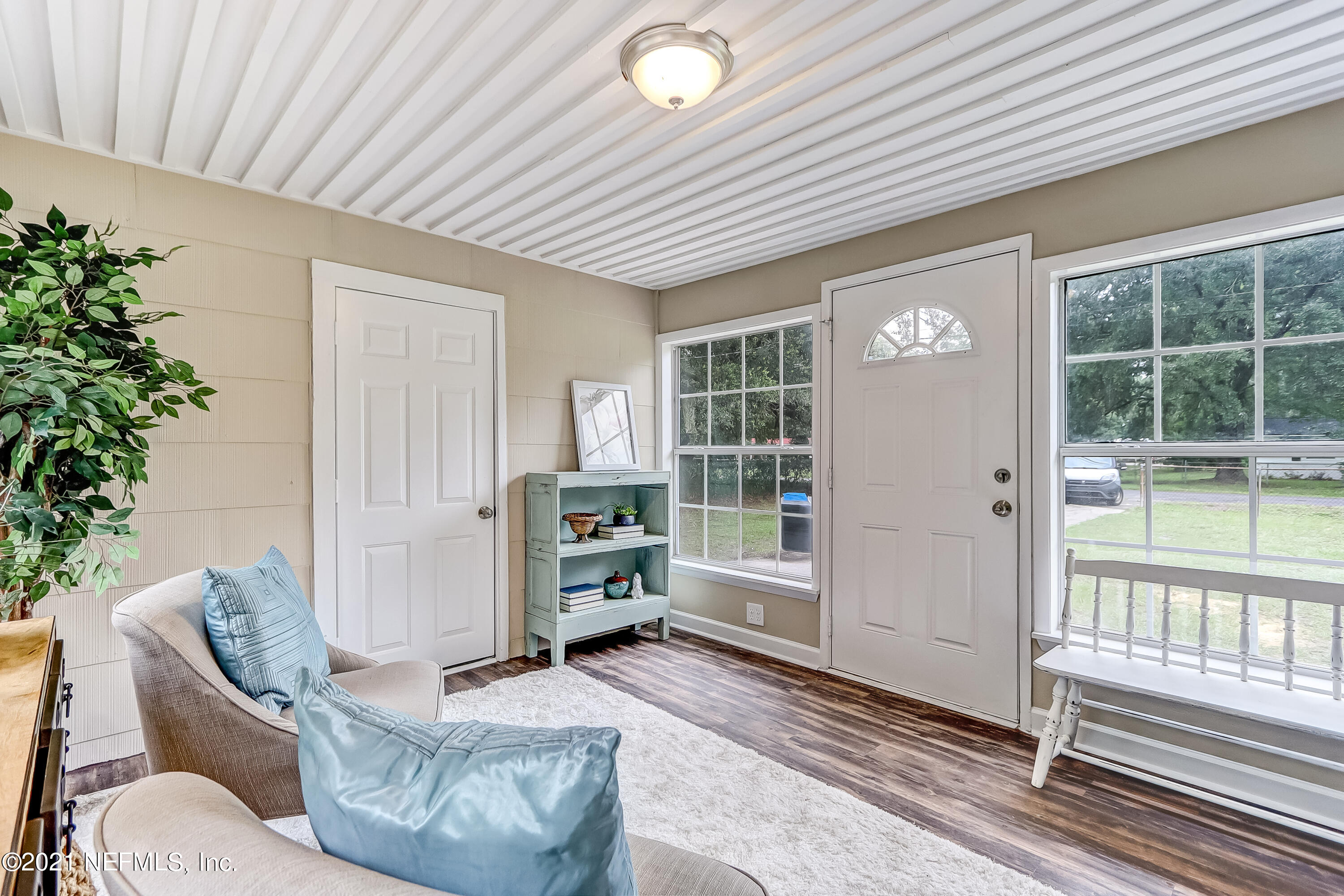 1416 Fred Gray Road Jacksonville, FL 32218 - Photo 12 of 34 a living room with furniture and a potted plant