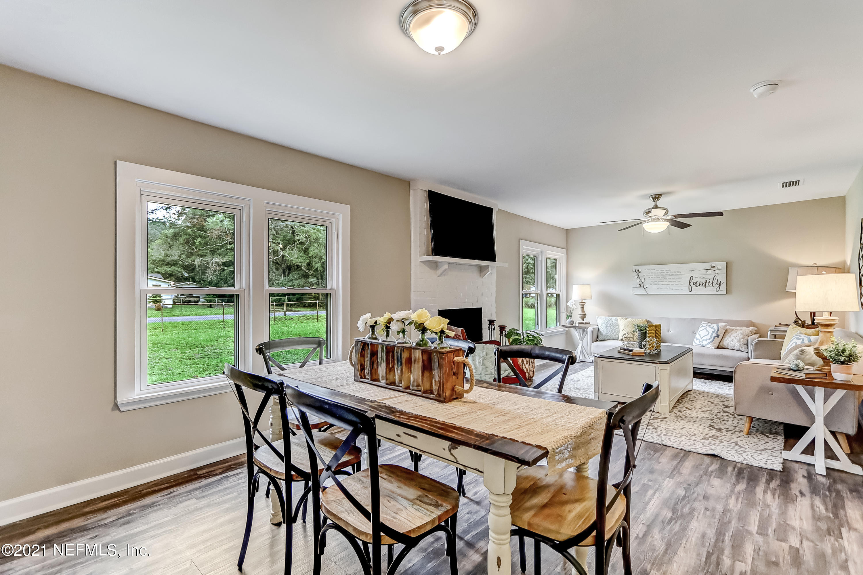 1416 Fred Gray Road Jacksonville, FL 32218 - Photo 14 of 34 a dining room with furniture and wooden floor
