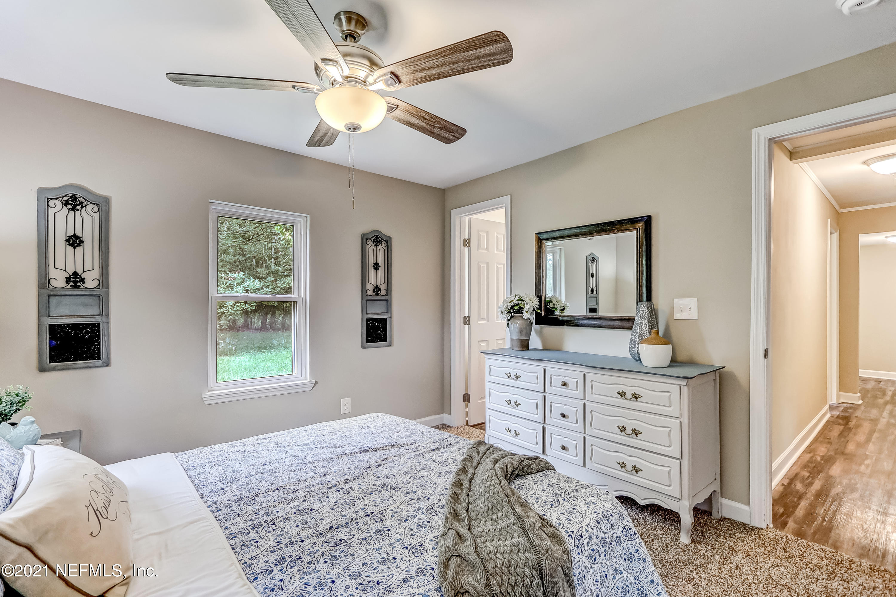 1416 Fred Gray Road Jacksonville, FL 32218 - Photo 27 of 34 a bedroom with a bed and a dresser