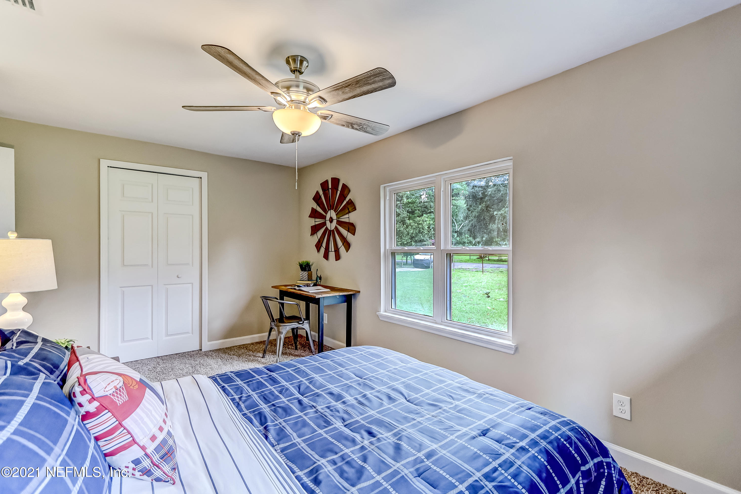 1416 Fred Gray Road Jacksonville, FL 32218 - Photo 29 of 34 a bedroom with a bed and a window