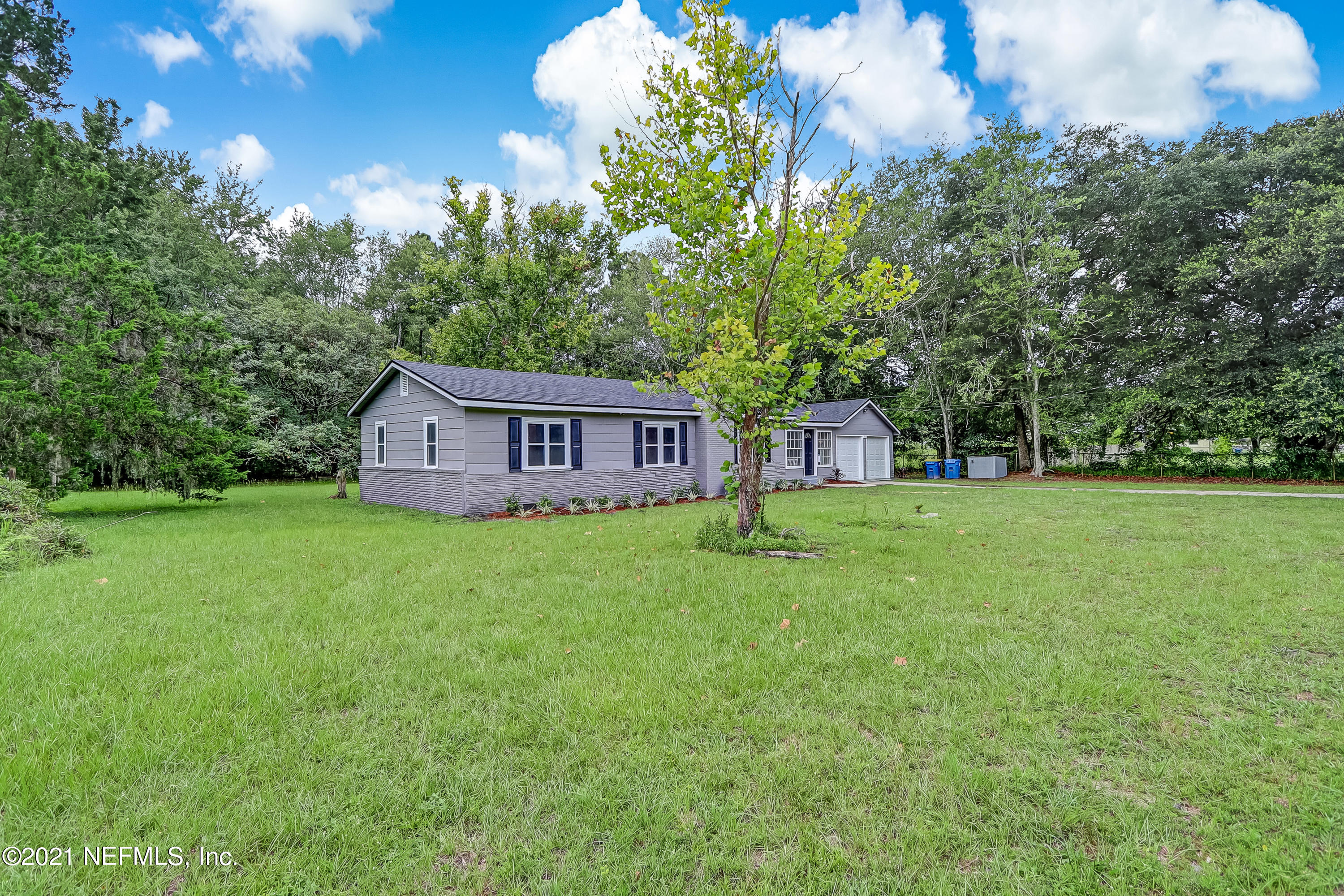 1416 Fred Gray Road Jacksonville, FL 32218 - Photo 5 of 34 a view of a house with backyard and garden
