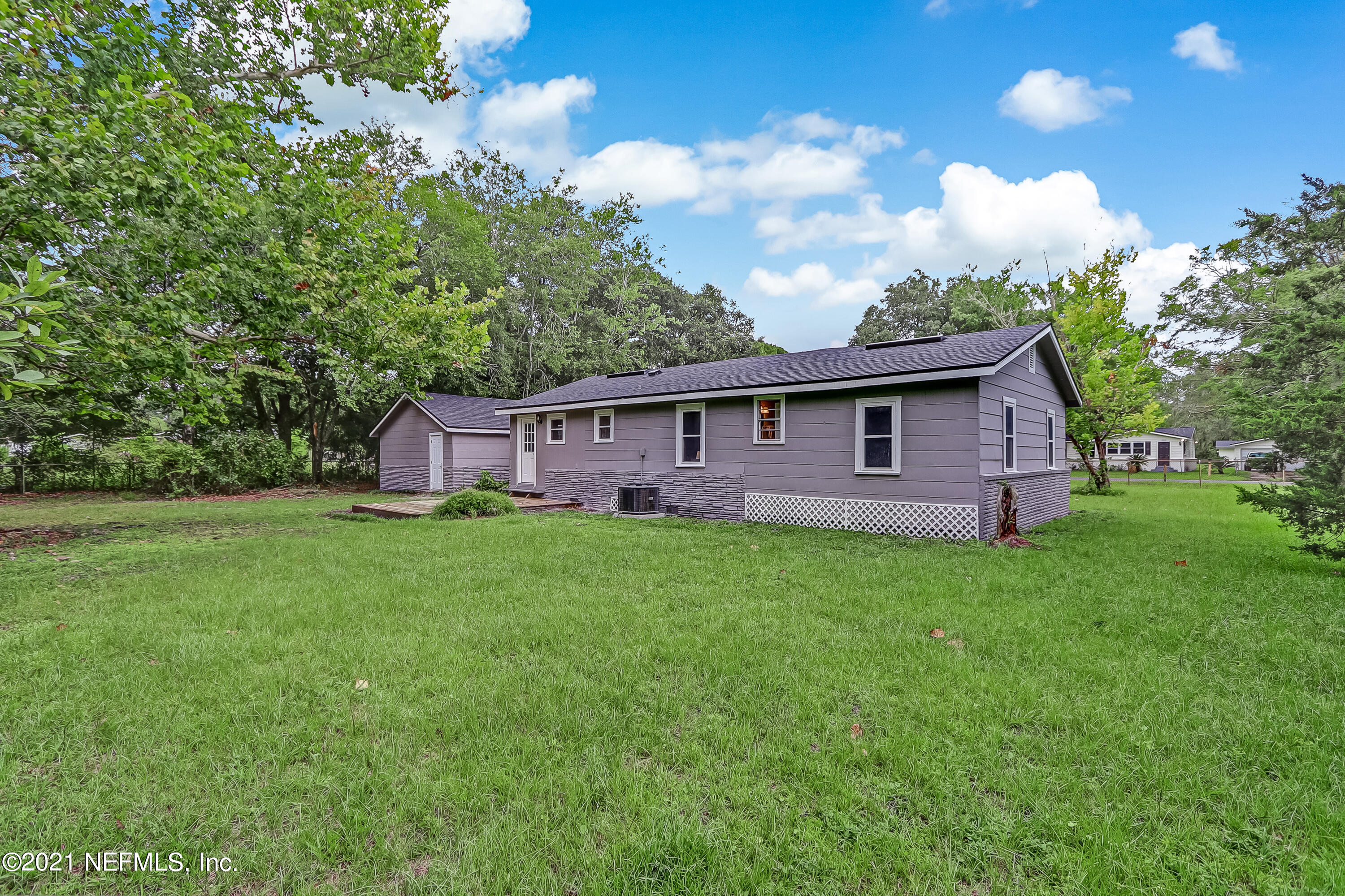 1416 Fred Gray Road Jacksonville, FL 32218 - Photo 6 of 34 a view of a house with backyard