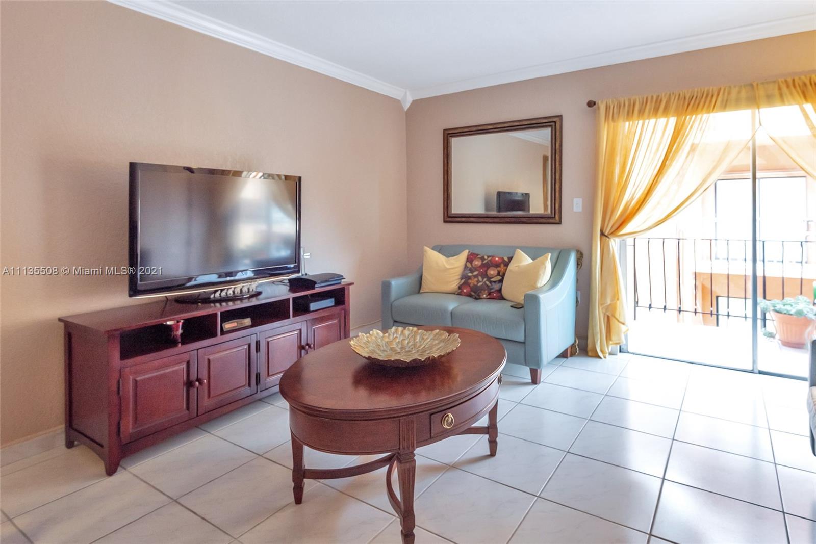 1900 West 54th Street, Unit 307 Hialeah, FL 33012 - Photo 12 of 49 a living room with furniture and a flat screen tv