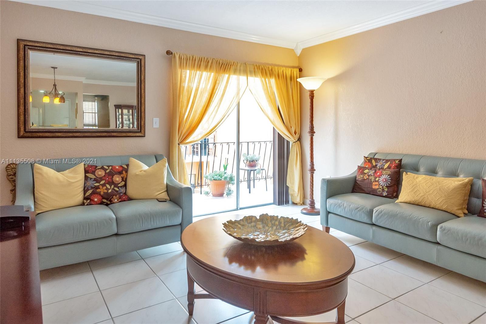 1900 West 54th Street, Unit 307 Hialeah, FL 33012 - Photo 13 of 49 a living room with furniture and a large window