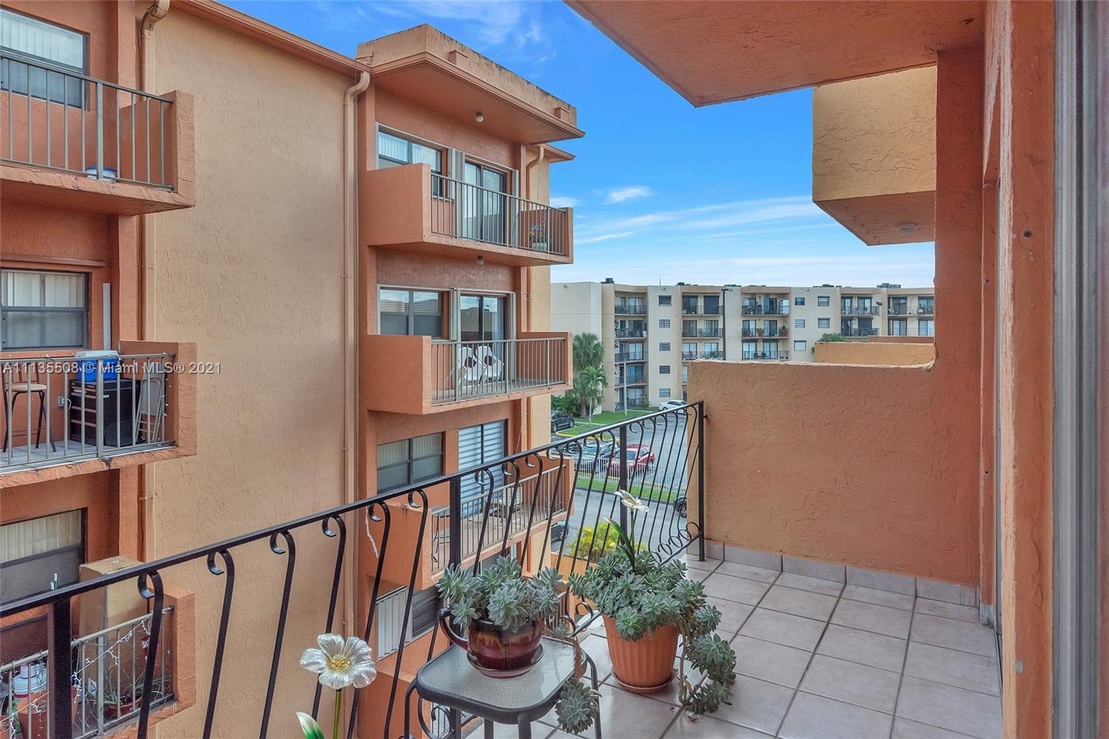 1900 West 54th Street, Unit 307 Hialeah, FL 33012 - Photo 16 of 49 a view of a balcony with an outdoor seating