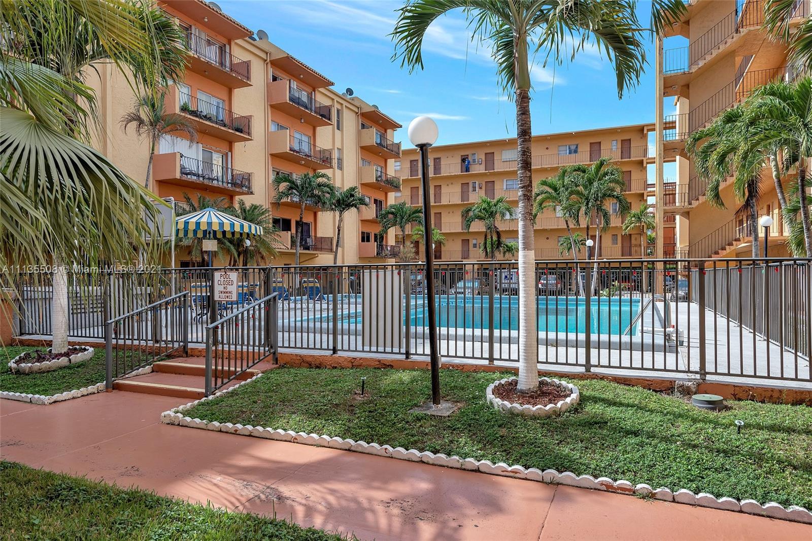 1900 West 54th Street, Unit 307 Hialeah, FL 33012 - Photo 3 of 49 a view of a backyard with a garden and plants