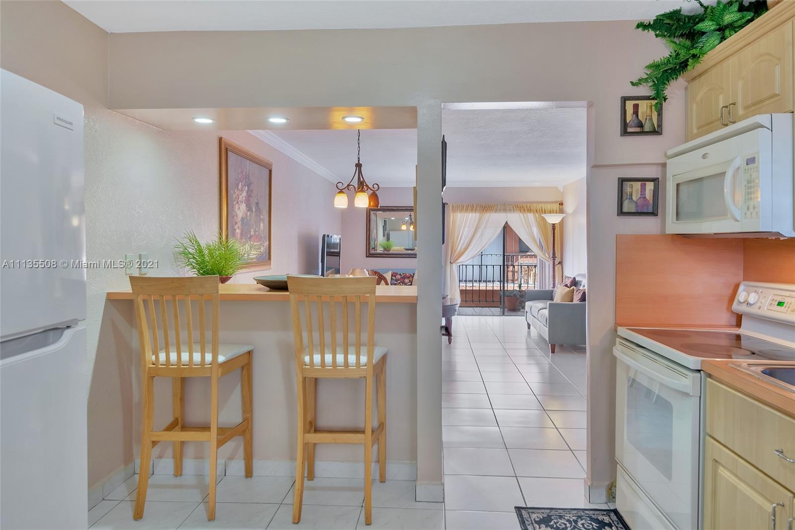 1900 West 54th Street, Unit 307 Hialeah, FL 33012 - Photo 27 of 49 a view of a dining room with furniture