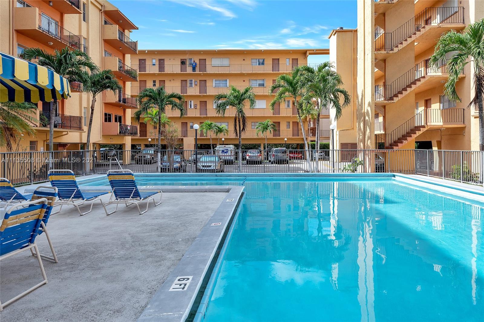 1900 West 54th Street, Unit 307 Hialeah, FL 33012 - Photo 4 of 49 a view of a building with a swimming pool