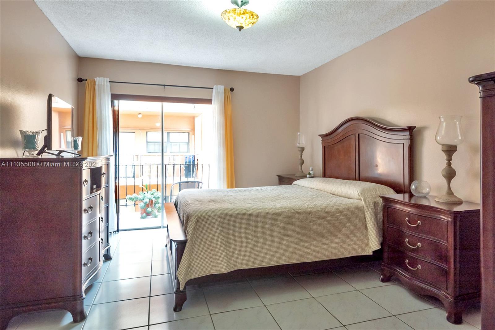 1900 West 54th Street, Unit 307 Hialeah, FL 33012 - Photo 33 of 49 a bedroom with a bed and a cabinets