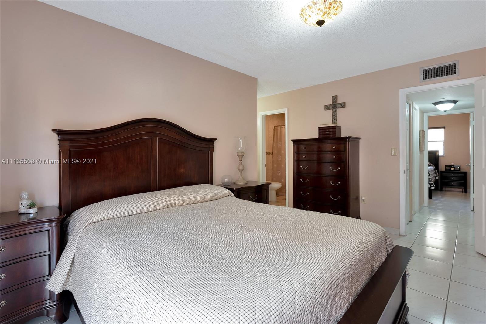 1900 West 54th Street, Unit 307 Hialeah, FL 33012 - Photo 34 of 49 a bedroom with a bed and a dresser