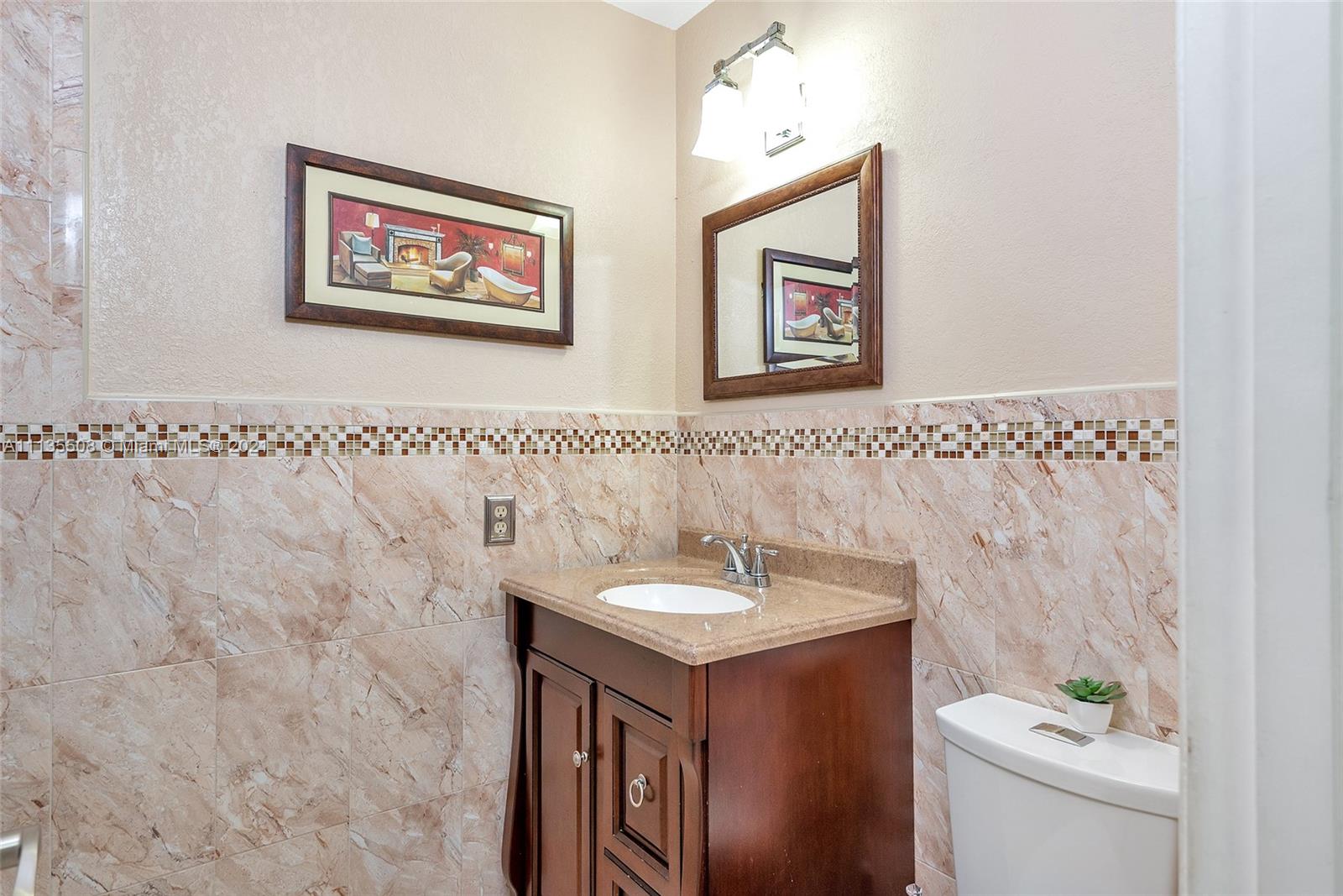 1900 West 54th Street, Unit 307 Hialeah, FL 33012 - Photo 43 of 49 a bathroom with a sink and a toilet