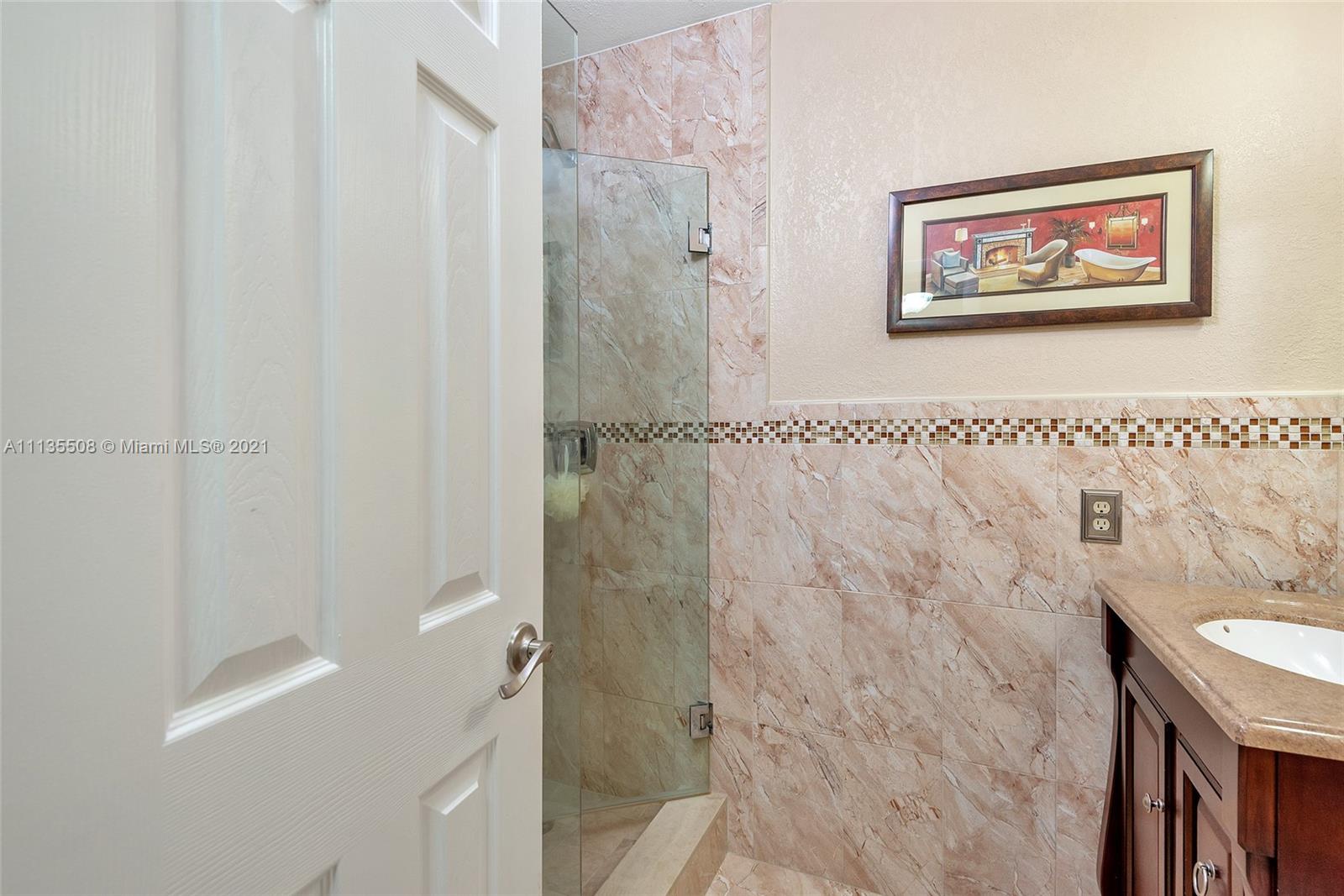 1900 West 54th Street, Unit 307 Hialeah, FL 33012 - Photo 44 of 49 a bathroom with a shower and a sink