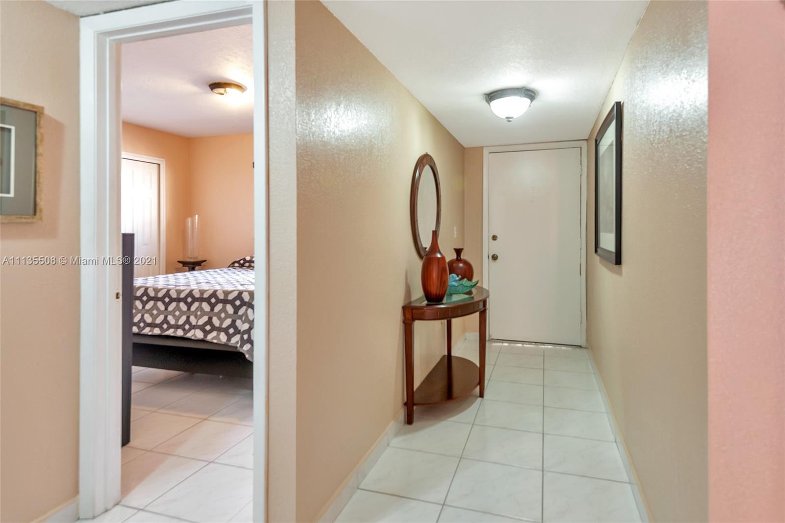 1900 West 54th Street, Unit 307 Hialeah, FL 33012 - Photo 48 of 49 a view of a livingroom with furniture and entryway