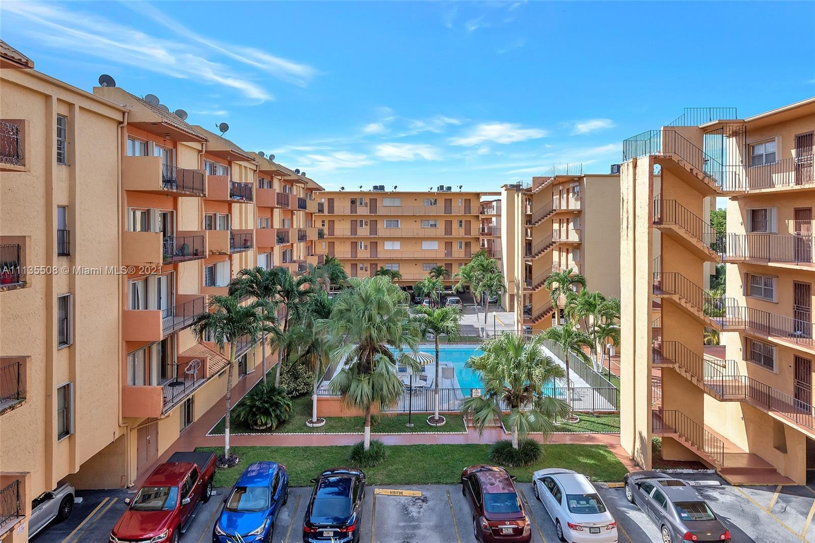 1900 West 54th Street, Unit 307 Hialeah, FL 33012 - Photo 49 of 49 a front view of a building with garden