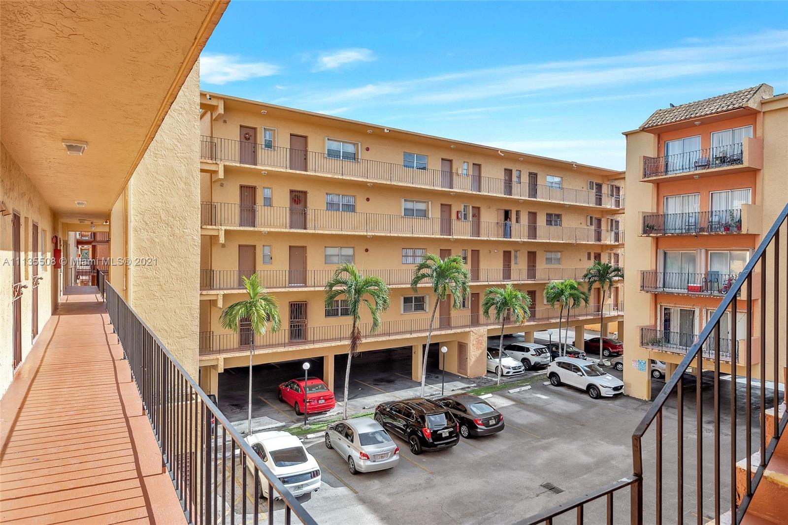 1900 West 54th Street, Unit 307 Hialeah, FL 33012 - Photo 6 of 49 a front view of a house with outdoor seating