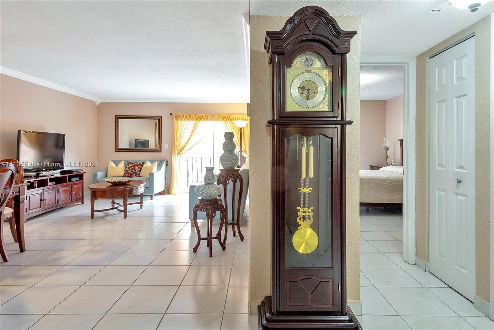 1900 West 54th Street, Unit 307 Hialeah, FL 33012 - Photo 8 of 49 a view of living room with furniture and rug