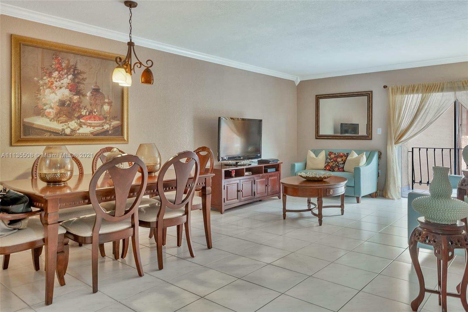 1900 West 54th Street, Unit 307 Hialeah, FL 33012 - Photo 9 of 49 a living room with furniture and a flat screen tv