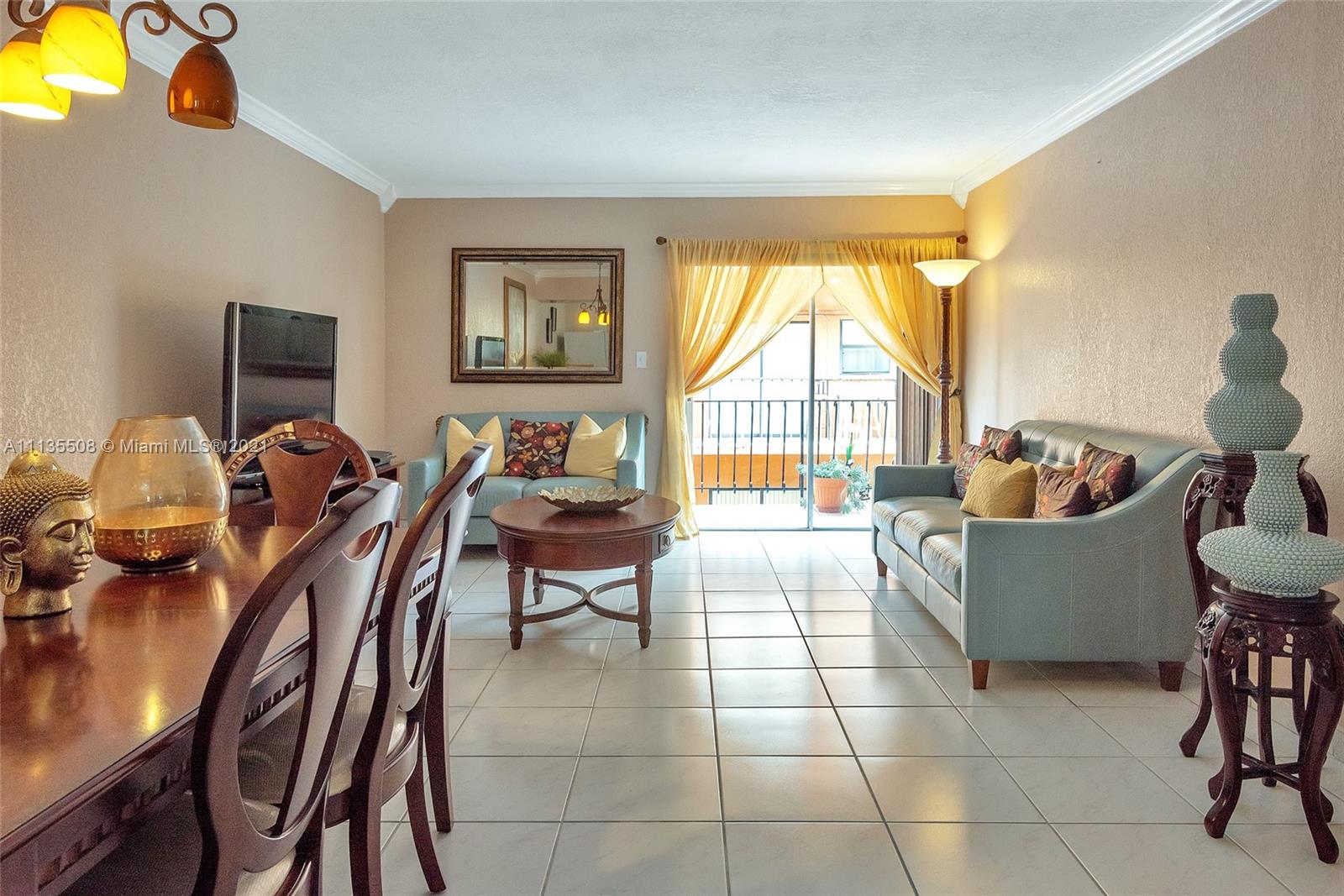 1900 West 54th Street, Unit 307 Hialeah, FL 33012 - Photo 10 of 49 a living room with furniture and a flat screen tv