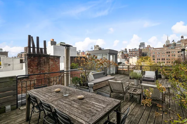 a view of balcony with furniture