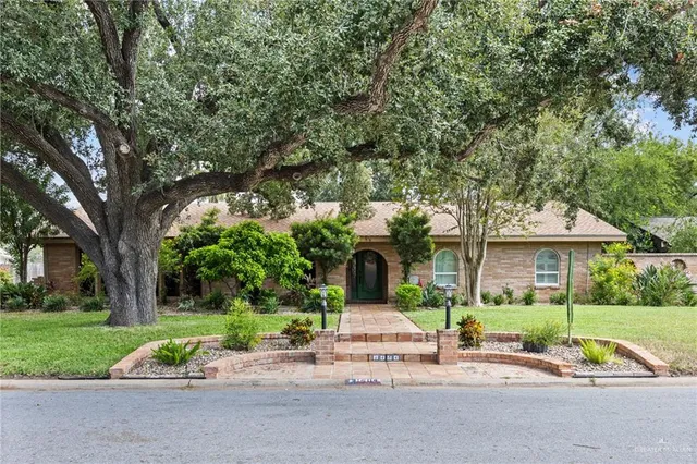 a front view of a house with a yard table and chairs