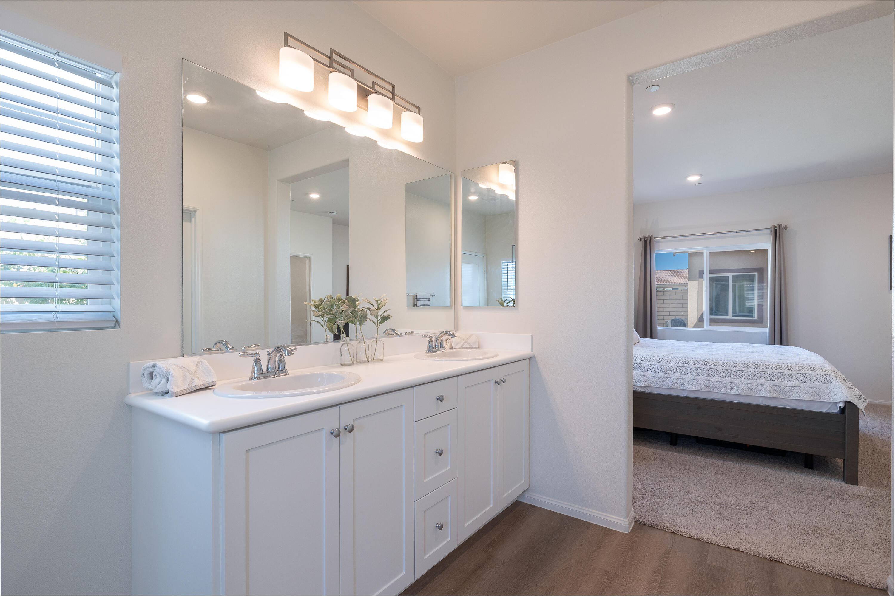 67425 Rio Naches Road Cathedral City, CA 92234 - Photo 14 of 19 a en suite bathroom with a double vanity sink and a mirror