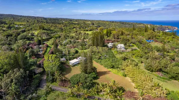 a aerial view of a house with a yard