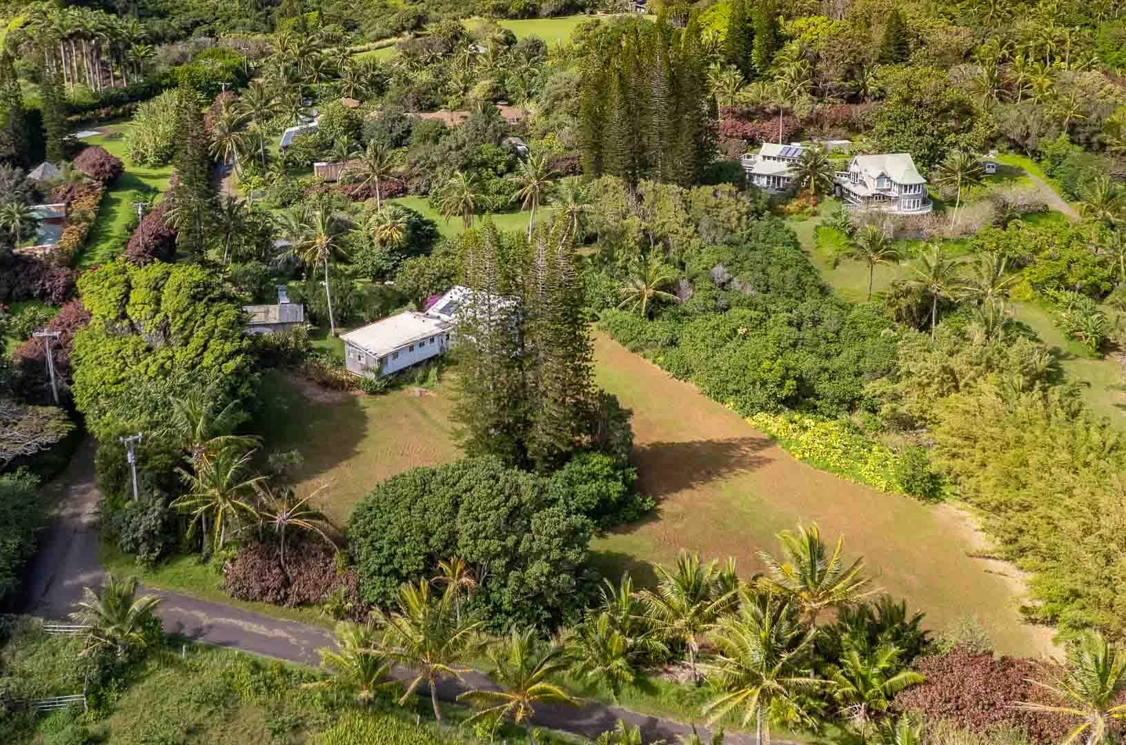 210 Door Of Faith Road Haiku, HI 96708 - Photo 18 of 46 a view of a lake with a house